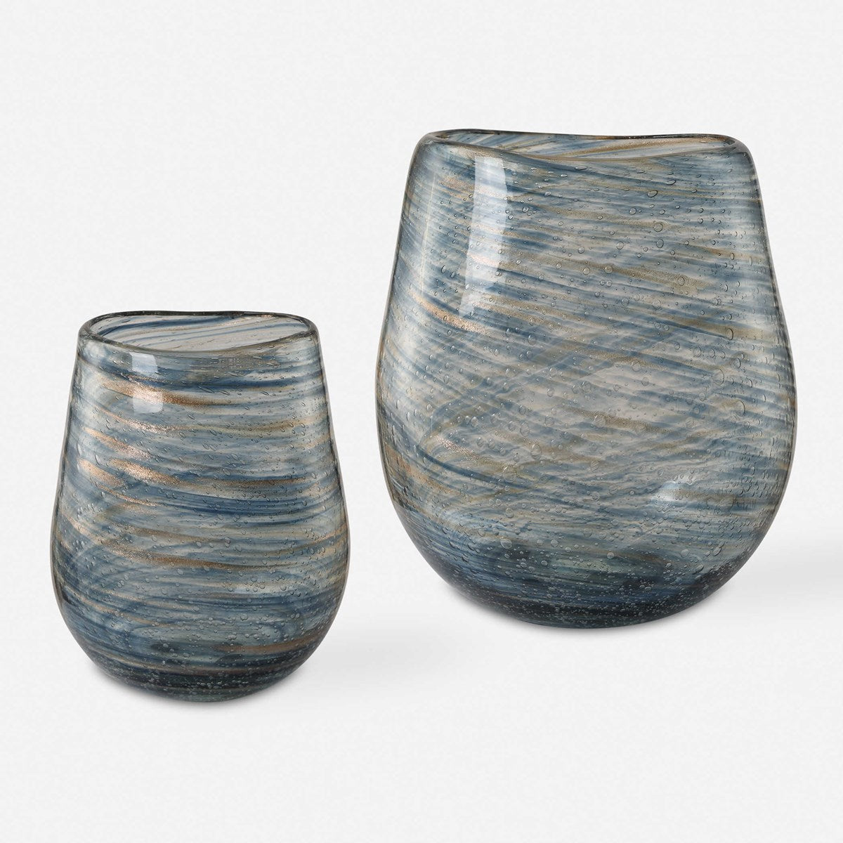 Aurora Swirl Vase from DA Atelier’s Bozeman, Montana collection, showcasing a captivating blue and gold swirled pattern on clear bubble glass.